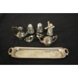 A novelty miniature gadrooned four piece silver tea set on twin handled tray along with a