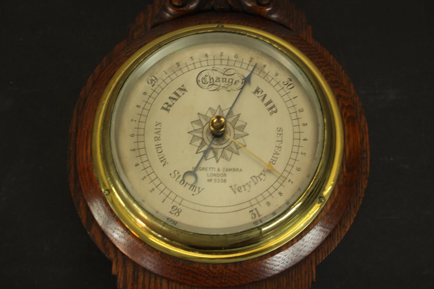 A circa 1900's Negretti & Zamba carved oak barometer and thermometer with shell and flower motifs. - Image 4 of 7