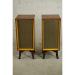 A pair of mid 20th century His Master's Voice DLS 519 speakers, with walnut cases on splayed legs.