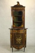 An early 20th century Continental floor standing corner cabinet, mahogany and marquetry inlaid,