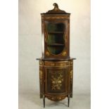 An early 20th century Continental floor standing corner cabinet, mahogany and marquetry inlaid,