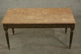 A 20th century French coffee table of rectangular form with a marble top, the gold coloured base