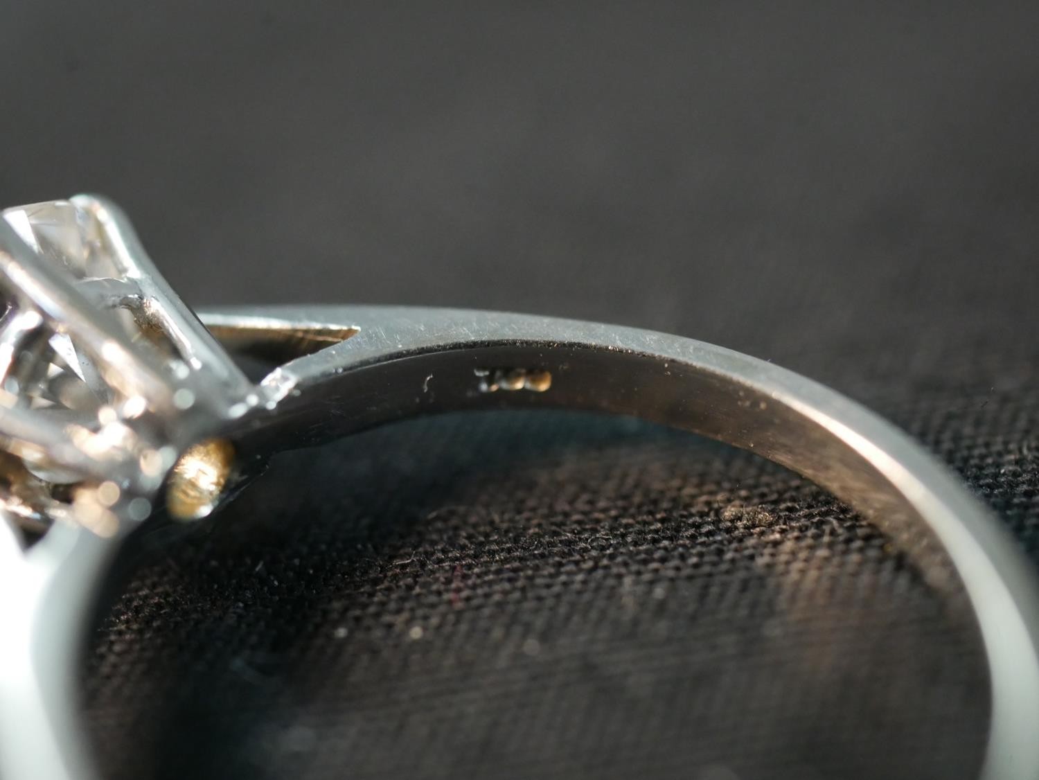 An 18 carat white gold solitaire diamond ring, set with a round old cut diamond in an open back - Image 5 of 7
