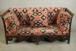 A vintage carved two seater canape. H.78 W.167 D.69cm.