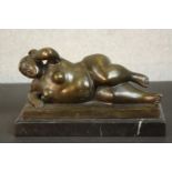 After Duchoiselle, 19th Century, Femme nue allongée, bronze with brown patina on marble base,