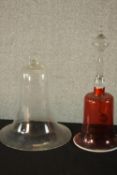 A ruby and white glass Victorian table bell along with a clear blown glass bell. H.35 Dia15cm. (