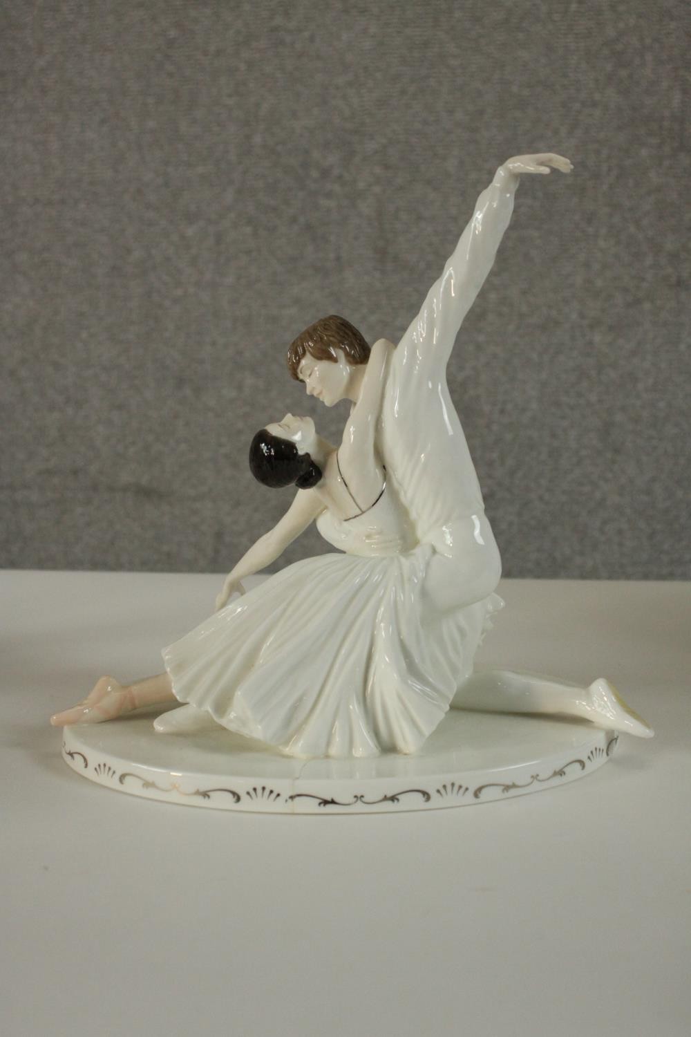 A collection of ten hand painted porcelain figures by various makers. Figures include a Lladro - Image 9 of 15