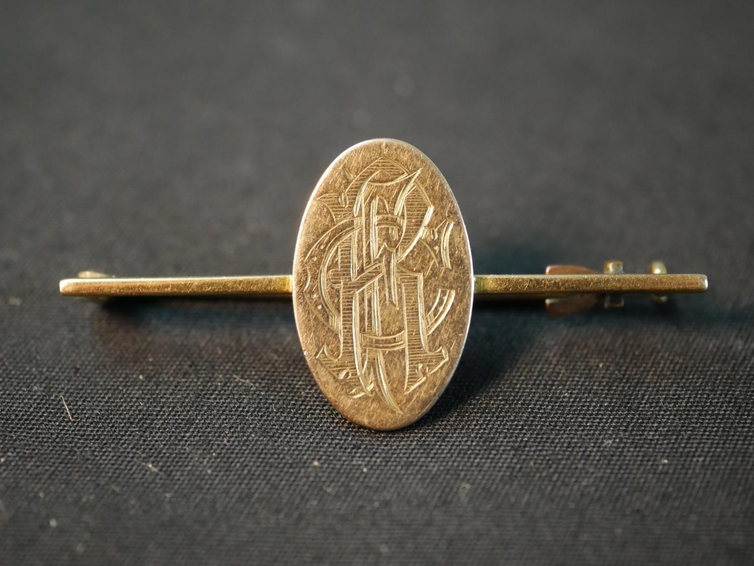 A yellow metal (tests as 9ct) engraved monogram bar brooch along with three 9ct shirt studs and a - Image 2 of 10