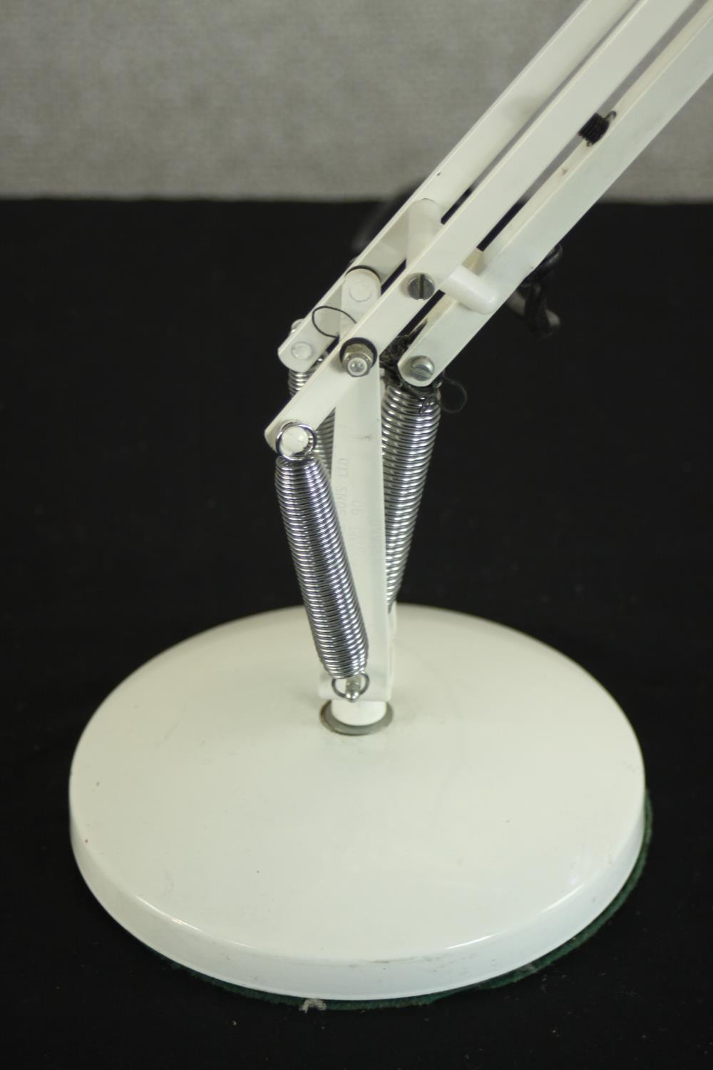 A mid 20th century Herbert Terry style anglepoise desk lamp, in white with a circular base. H.85 - Image 4 of 7