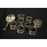 A collection of seven silver napkin rings, a Victorian silver and tortoiseshell box and a Scottish