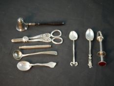 A collection of silver cutlery, including a pair of silver and red enamel sprung ice tongs by