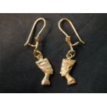 A pair of 18 carat engraved Egyptian Nefertiti head earrings with shepherds hook fittings.