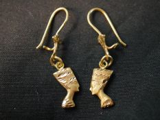 A pair of 18 carat engraved Egyptian Nefertiti head earrings with shepherds hook fittings.