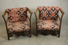 A pair of early 20th century carved open armchairs. H.74 W.79 D.79cm. (each)