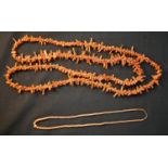 A long early 20th century orange branch coral necklace along with a Victorian graduated coral bead