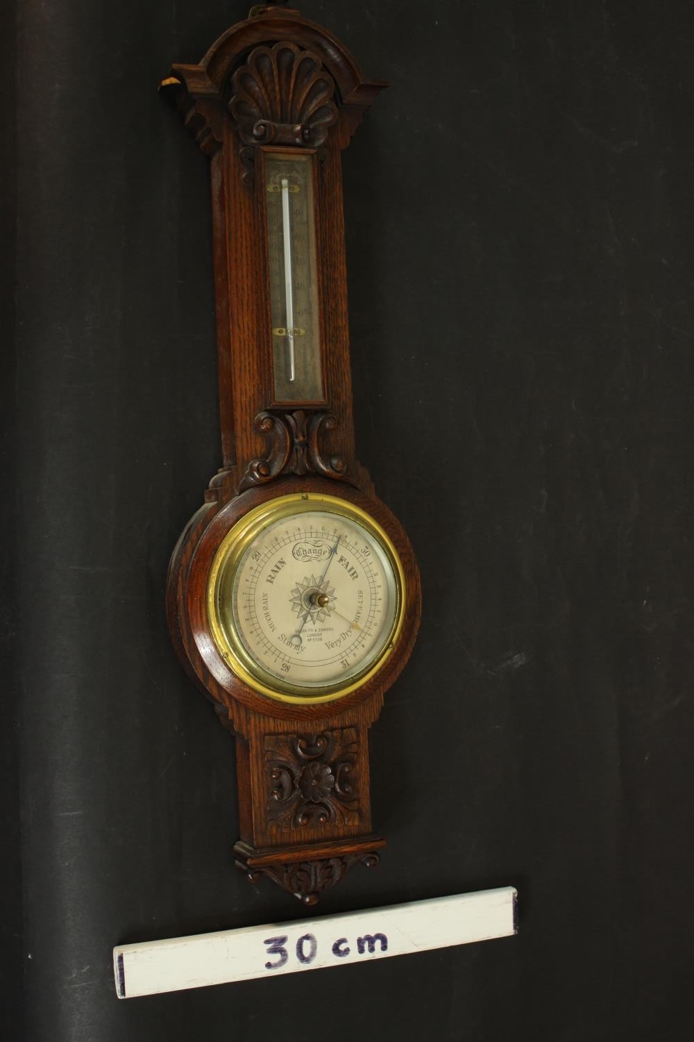 A circa 1900's Negretti & Zamba carved oak barometer and thermometer with shell and flower motifs. - Image 2 of 7