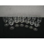 A collection of fourteen glasses, a set of eight ribbed design wine glasses and six etched with