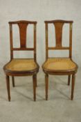 A pair of late 19th century French burr walnut side chairs, with gilt metal mounts and a caned seat,