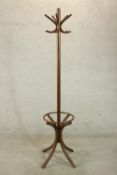 A 20th century bentwood hat and coat stand, with five curved hooks, on four splay supports. H.182