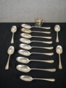 A collection of silver cutlery and a mustard pot, including twelve Victorian silver serving