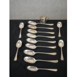 A collection of silver cutlery and a mustard pot, including twelve Victorian silver serving