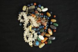 A collection of gemstone and glass jewellery, including an assortment of agate and lapis lazuli