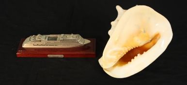A large Conch shell along with SILVER MUSE: a 1:1000 scale Silver Sea pewter model, 2018 celebrating