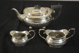 A Victorian three piece gadrooned design tea set by Alfred George Griffiths, Birmingham, 1902. H.