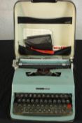 An Italian Olivetti Lettera 32 portable typewriter, in case. H.10 W.30 D.36cm.