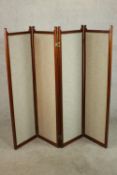 An Edwardian walnut fourfold screen, each panel upholstered with an oatmeal coloured fabric, with