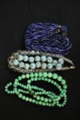 A collection of early 20th century glass bead necklaces, including a string of sixteen Murano