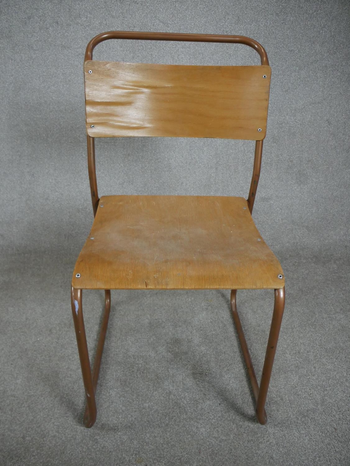 A set of four 1950s Redro plywood stacking school chairs, on brown painted tubular frames. H.84 W.44 - Image 3 of 6