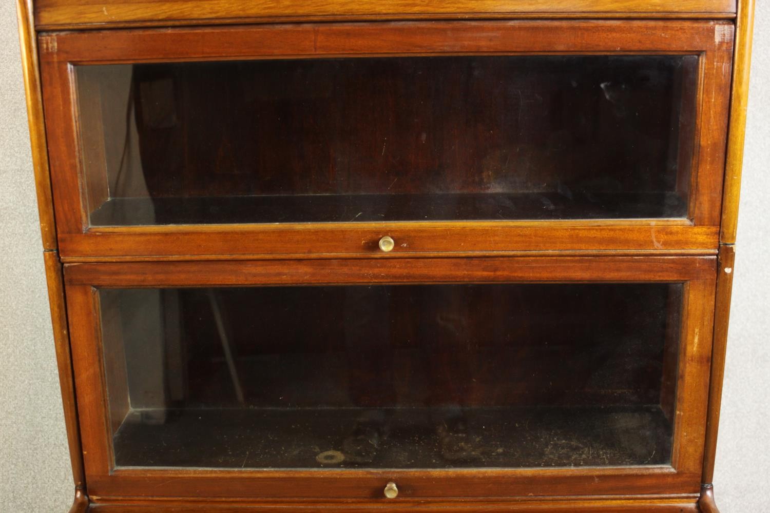 A mid 20th century mahogany Gumm stacking bookcase, with two glazed cupboard doors over three - Image 4 of 16