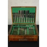 An Art Deco walnut canteen of silver plate cutlery for six people by Ensee (Cutlers) Limited,