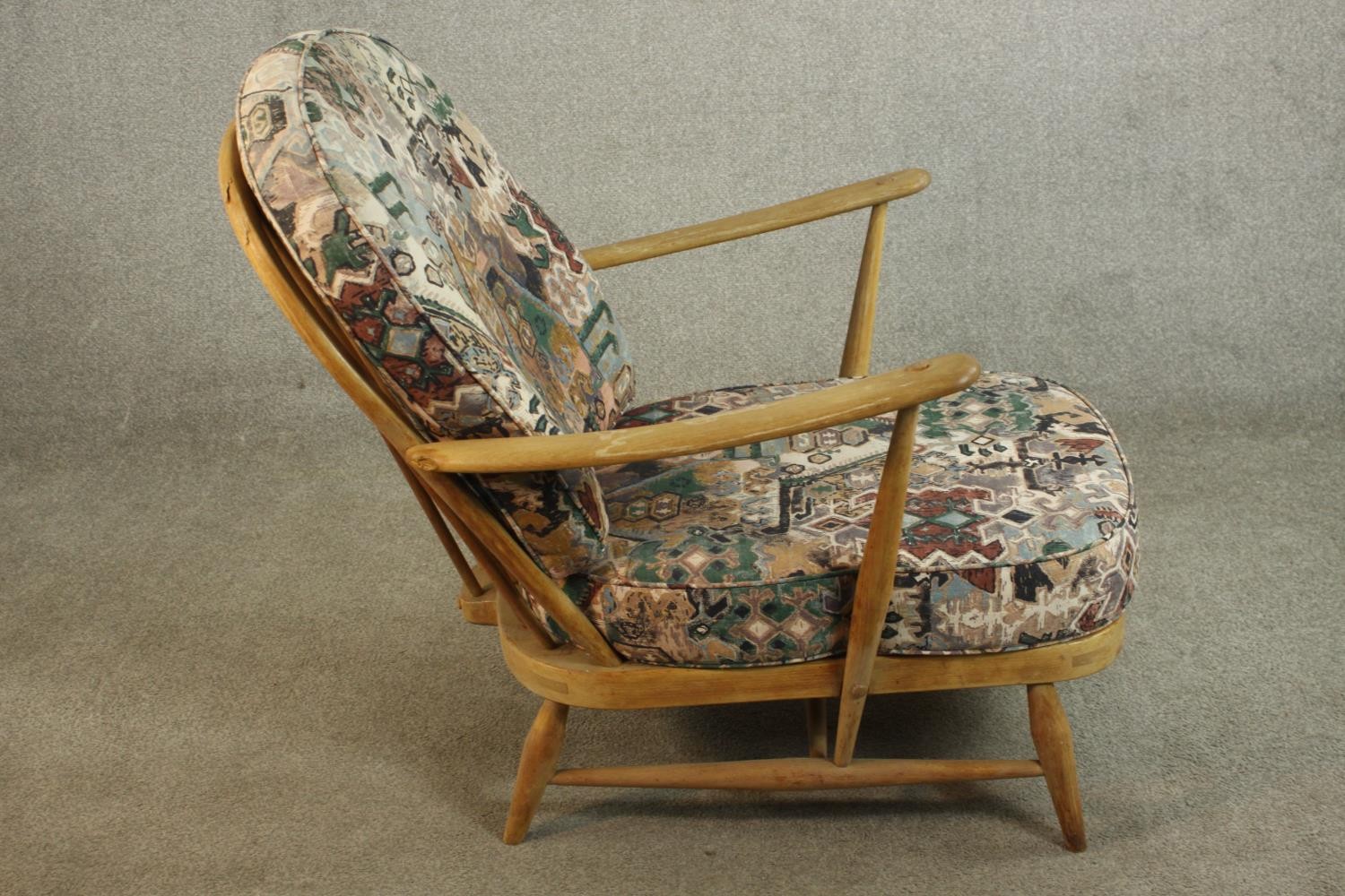 A pair of Ercol elm and beech hoop back armchairs, in Windsor style, with loose back and seat - Image 5 of 11