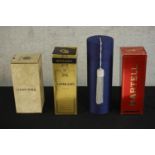 Four bottles of boxed spirits and champagne, including a bottle of Courvoisier Extra Vieille cognac,