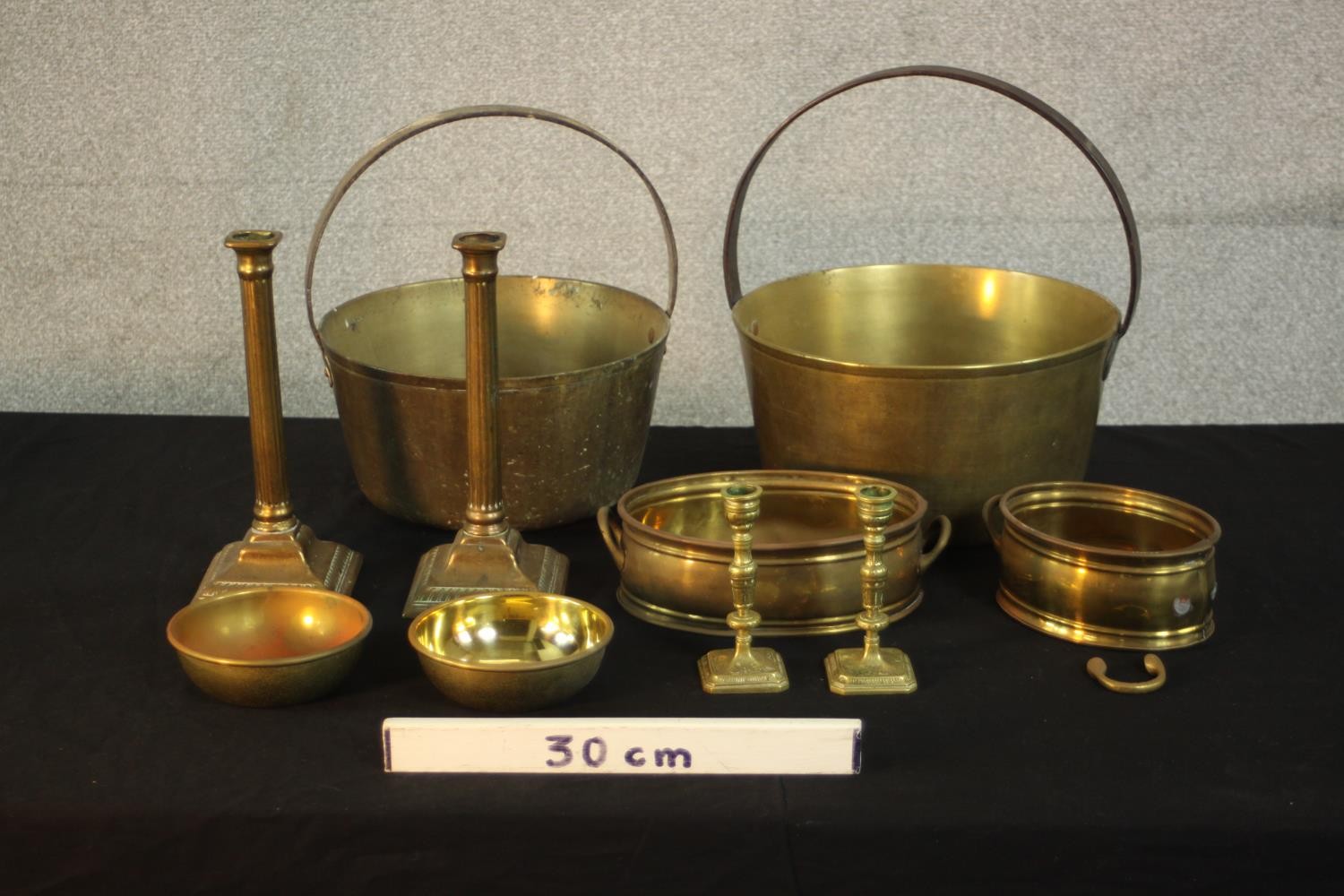 A collection of early 20th century brassware, including two brass preserve pans, two pairs of candle - Image 2 of 13