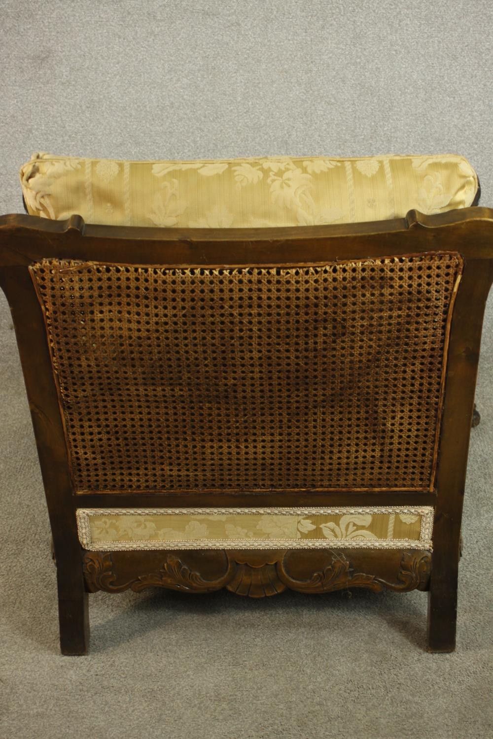 A pair of early 20th century Continental carved walnut bergere armchairs, upholstered in gold - Image 23 of 30