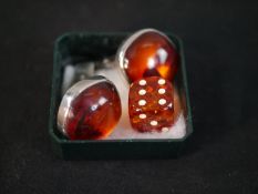 A pair of 1960's Danish amber cabochon and silver cufflinks designed by Einer Fehrn along with a