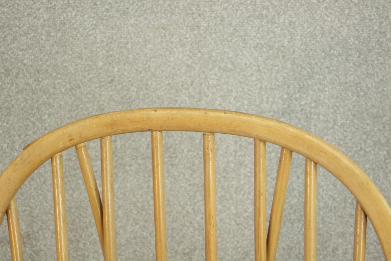 A pair of Ercol elm and beech hoop back armchairs, in Windsor style, with loose back and seat - Image 11 of 11