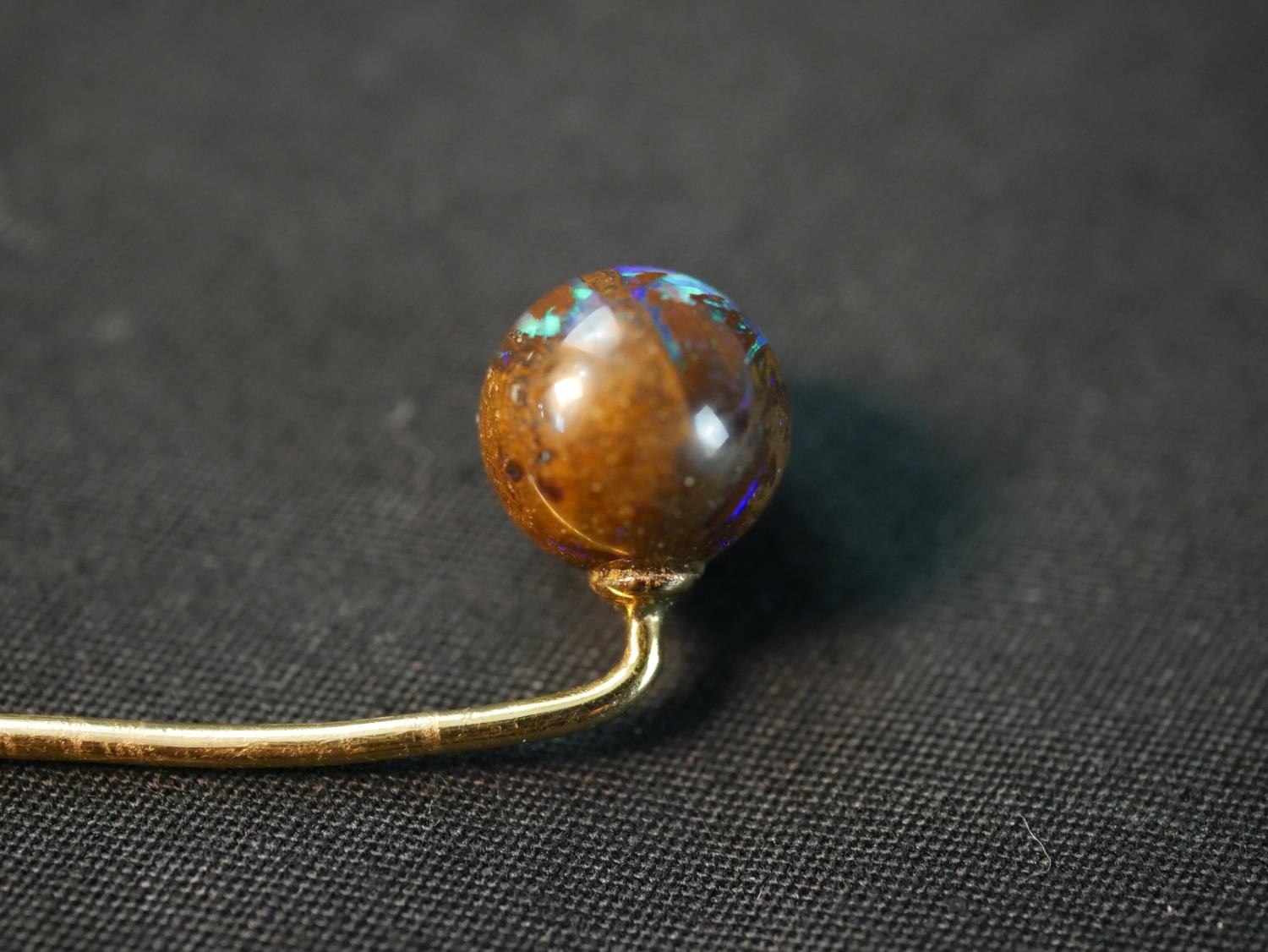 A yellow metal boulder opal stick pin, with carved and polished boulder opal ball to the end (good - Image 4 of 8