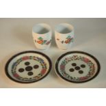 A pair of Japanese Kakiemon floral design porcelain cups, signed to base along with a pair of 19th