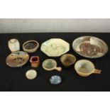 A collection of ten art pottery dishes and small bowls of various forms hand glazed with different