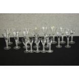 A collection of twenty clear glass double air twist stem glasses, including five cordial glasses and