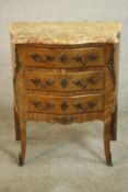 A French Louis XV style kingwood chest, with a serpentine marble top over three long drawers, on