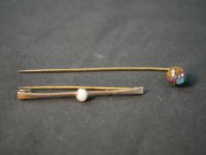 A yellow metal boulder opal stick pin, with carved and polished boulder opal ball to the end (good