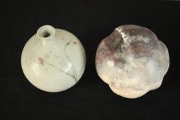 A collection of four art pottery vases of various forms and textures along with a bulbous raku