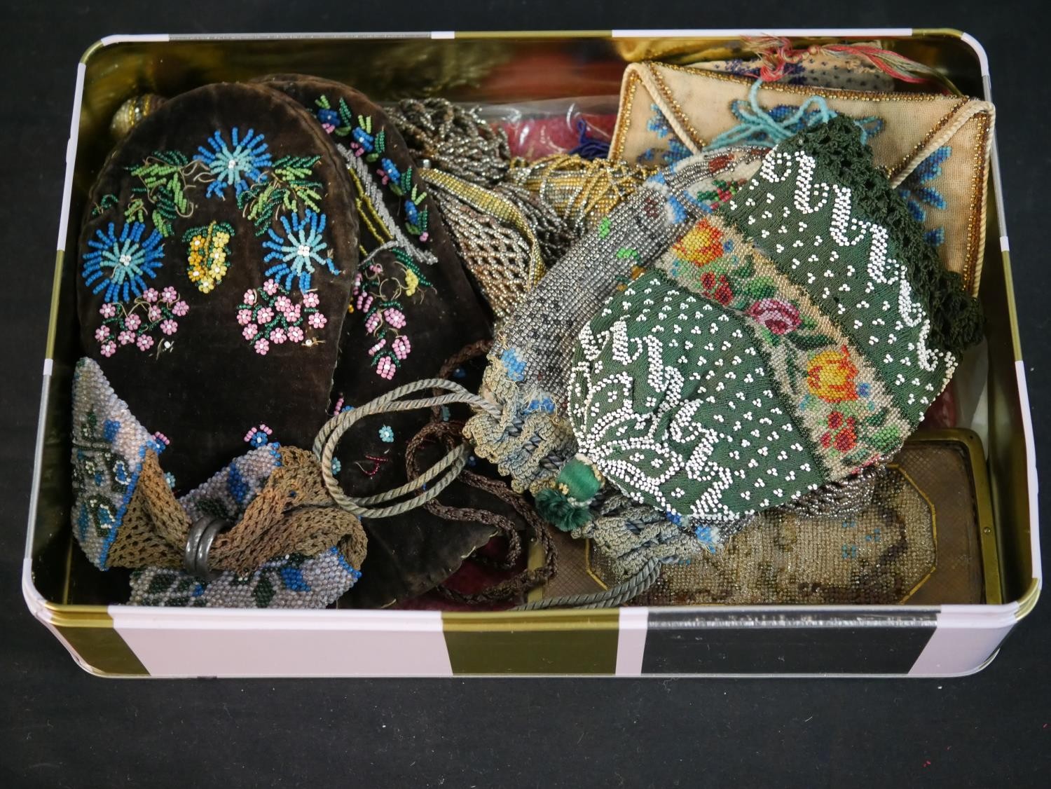 A collection of twelve antique hand beaded and embroidered bags each with a different design and - Image 2 of 9