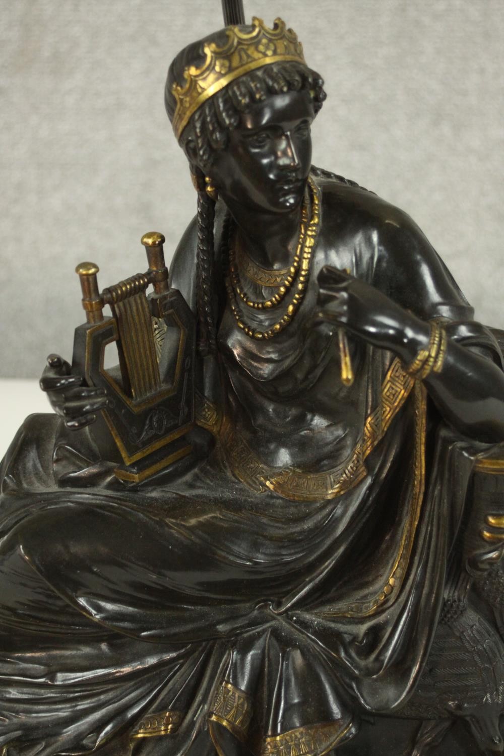 An Egyptian revival gilded bronze figural table lamp depicted as a female in flowing robes holding a - Image 4 of 7