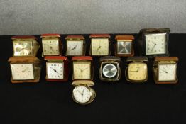 A collection of thirteen vintage cased travel clocks, makers include Europa, Estyma, Marksman and